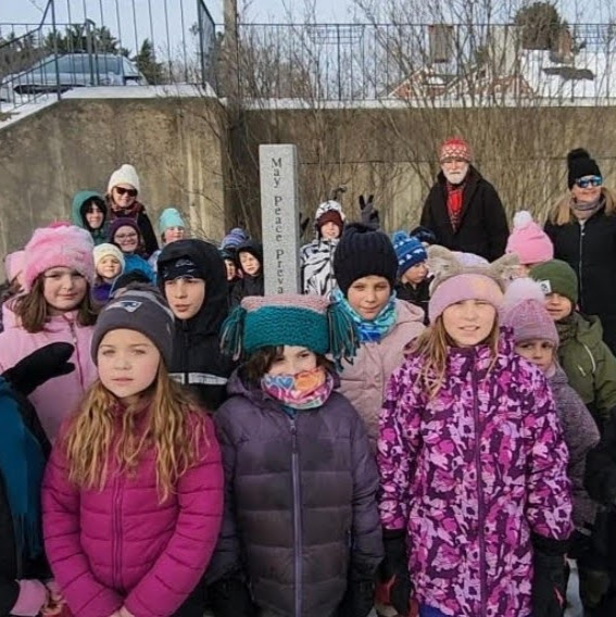 students with peace pole